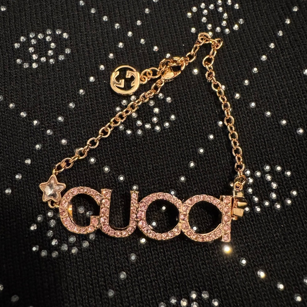 Gucci Gold and Pink Star Bracelet with Script Design